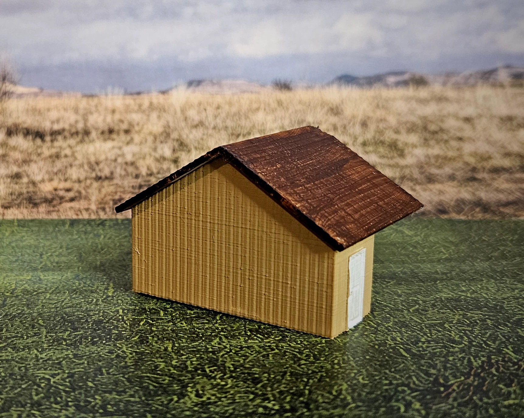 Close-up of HO scale large building and waterwheel